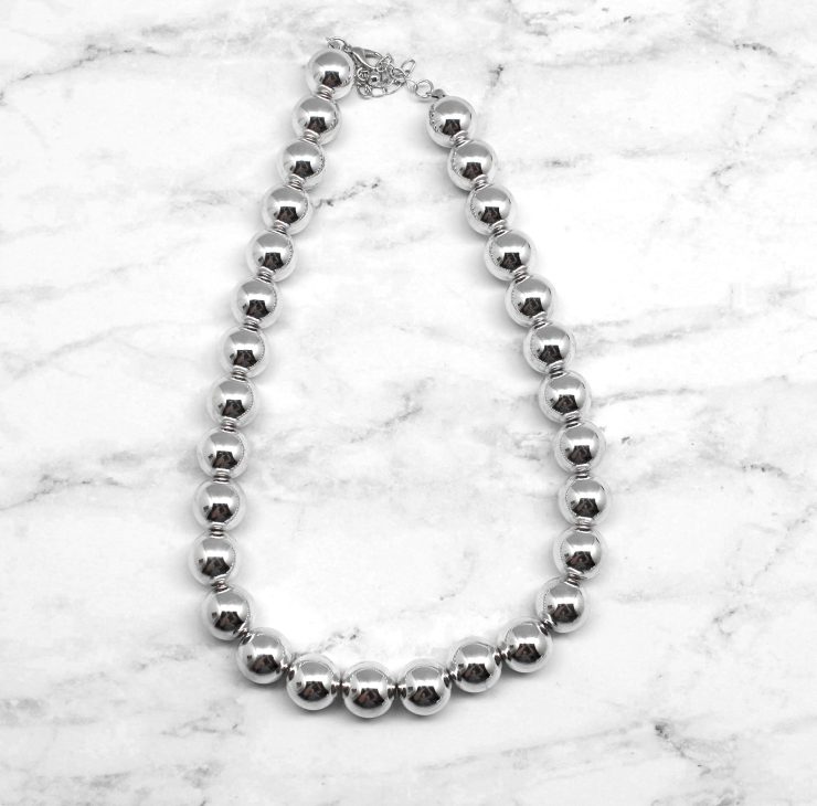 A photo of the A Class of It's Own Necklace product