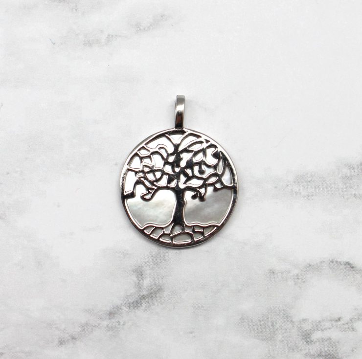 A photo of the To The Roots Pendant product