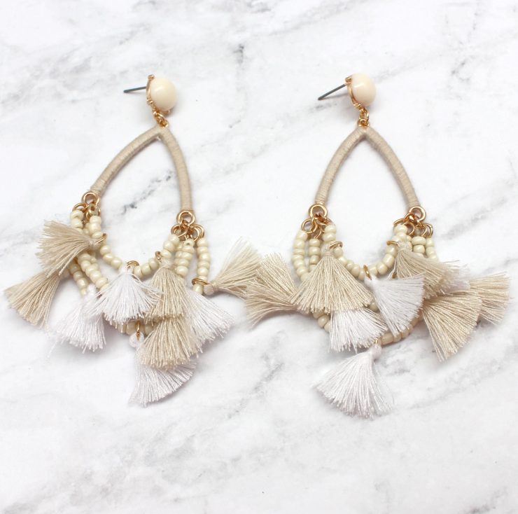 A photo of the Delicate Duster Earrings product