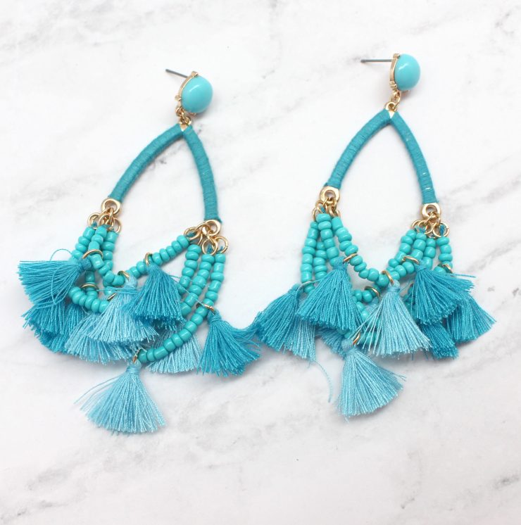 A photo of the Delicate Duster Earrings product