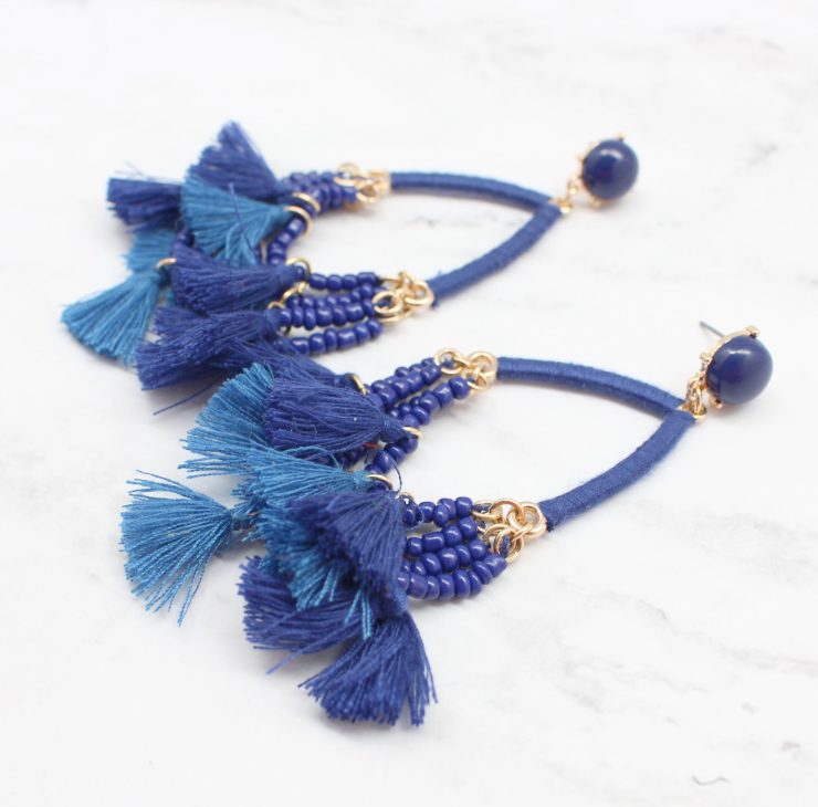 A photo of the Delicate Duster Earrings product