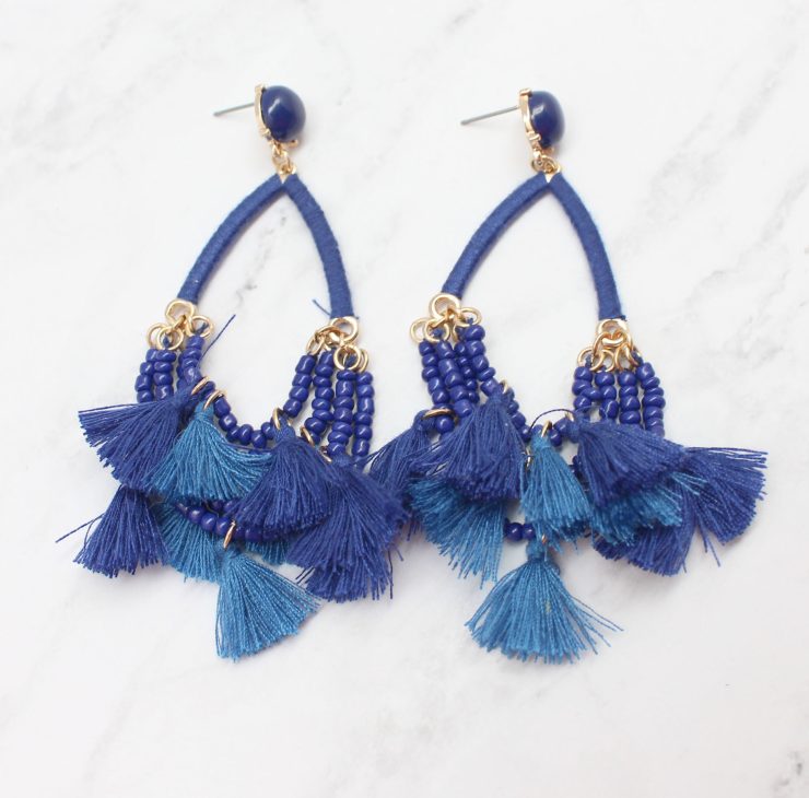 A photo of the Delicate Duster Earrings product