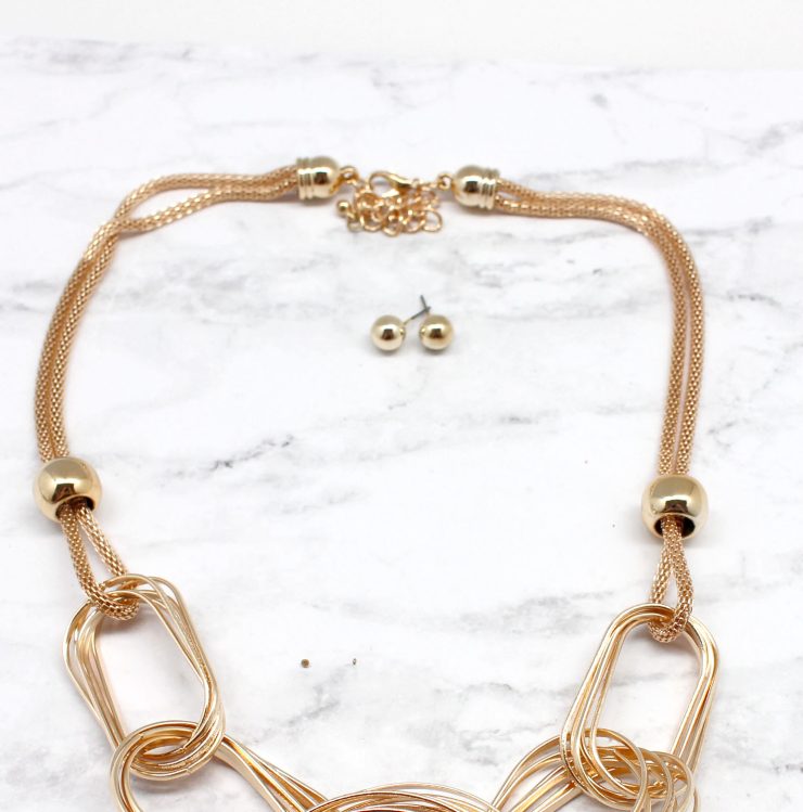 A photo of the Written In Gold Necklace product