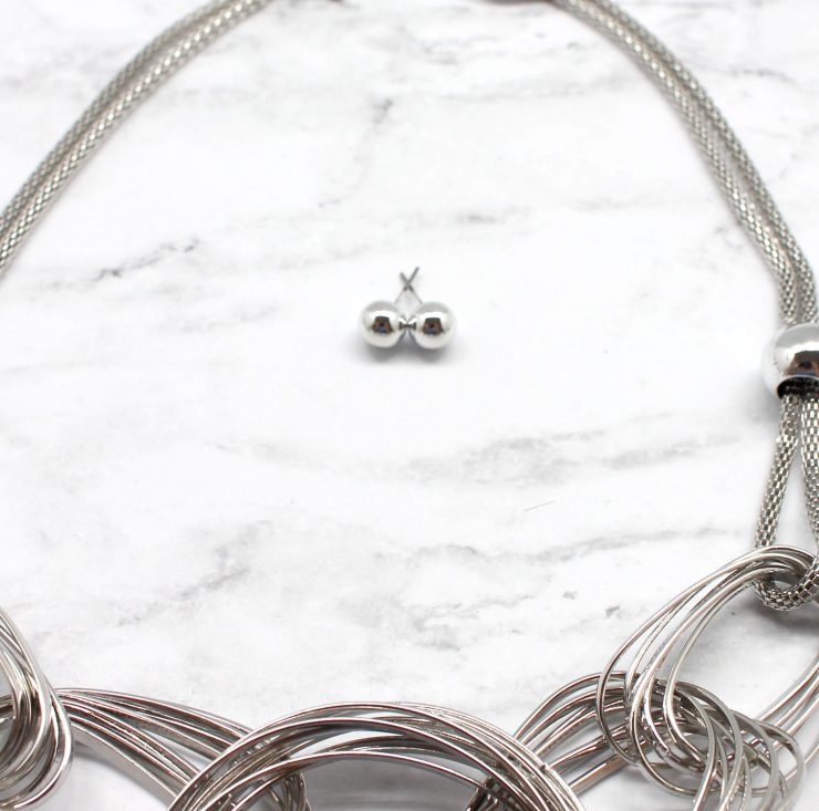 A photo of the Written In Silver Necklace product