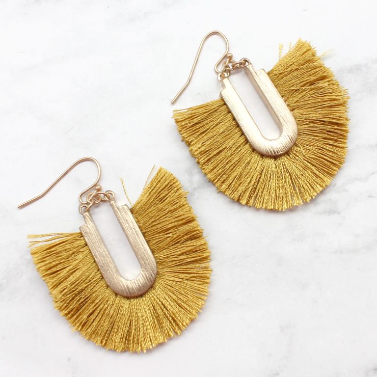 A photo of the Frilly Fringe Earrings product