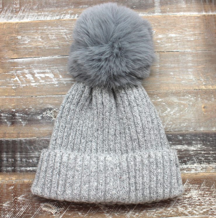 A photo of the The Regina Pom Pom Hat product