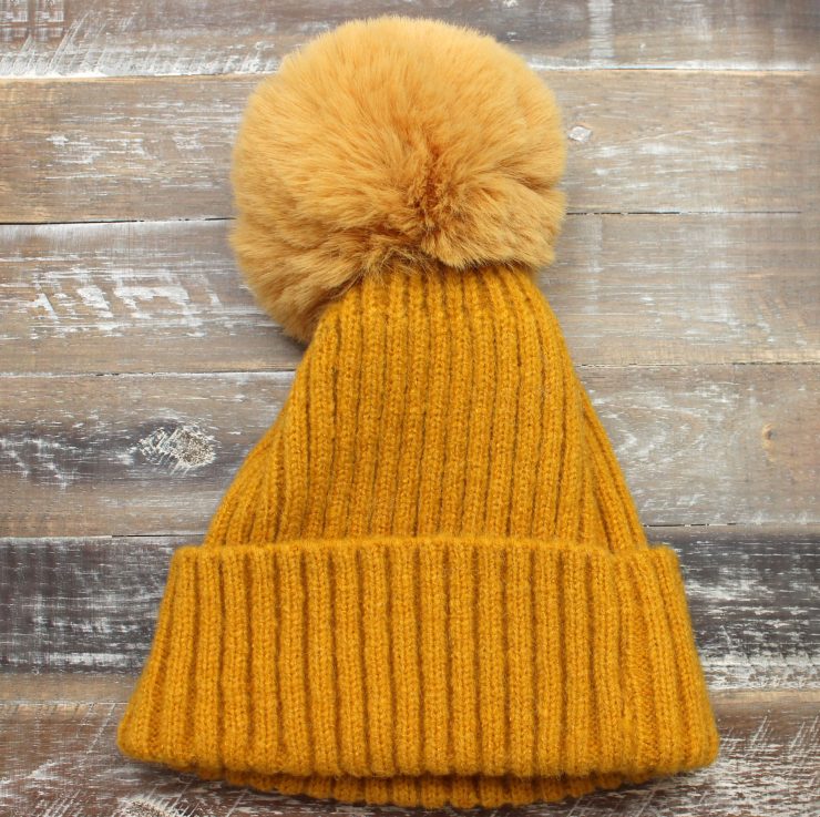 A photo of the The Regina Pom Pom Hat product