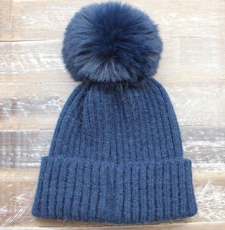 A photo of the The Regina Pom Pom Hat product