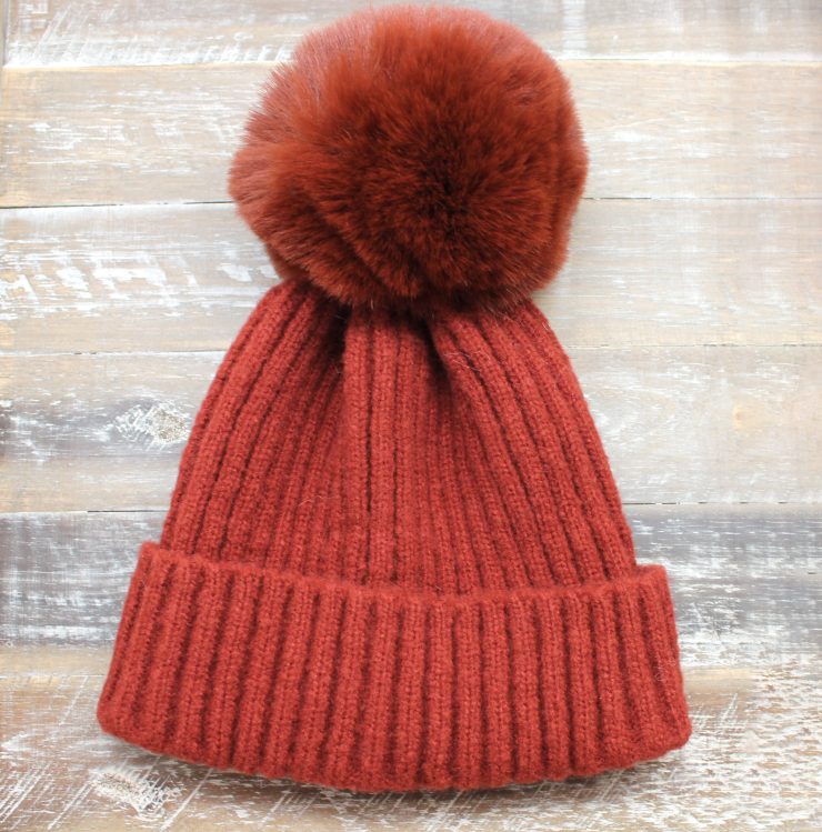 A photo of the The Regina Pom Pom Hat product