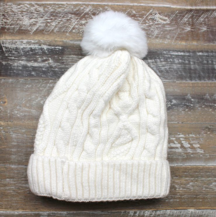 A photo of the Crochet Pom Pom Kids Beanie product