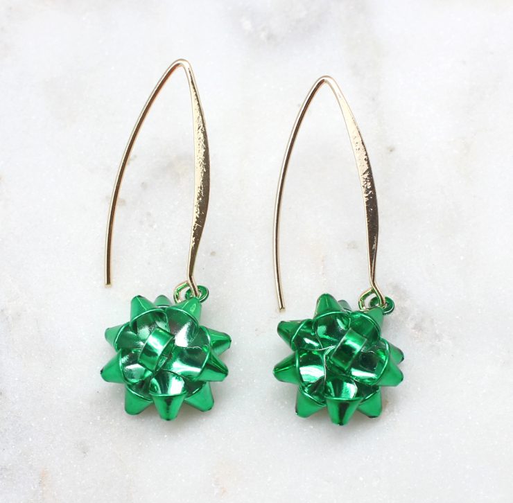 A photo of the Christmas Bow Dangle Earrings product