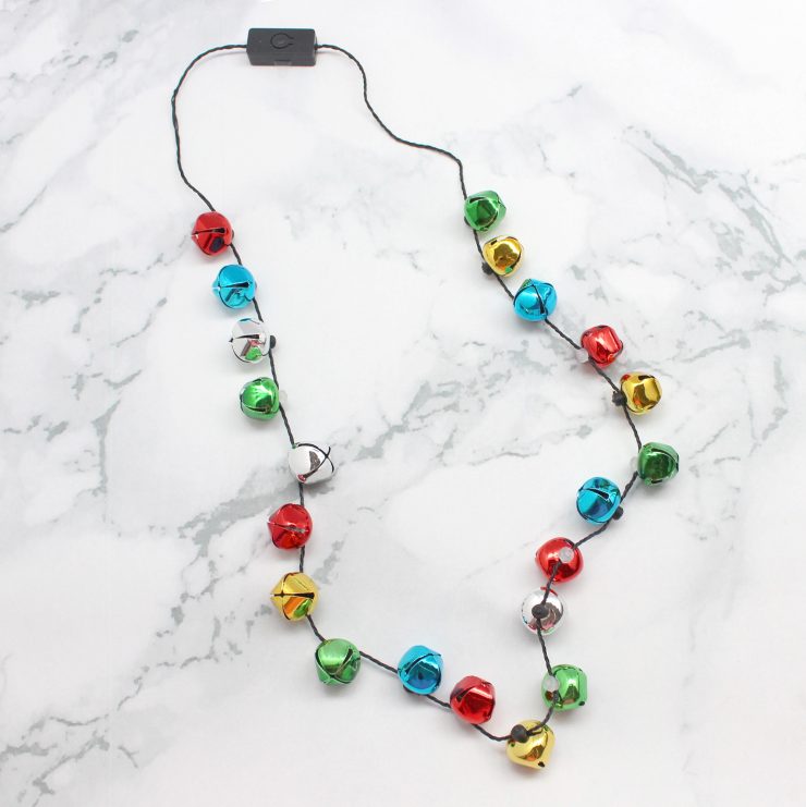 A photo of the Jingle Bell Light Up Necklace product