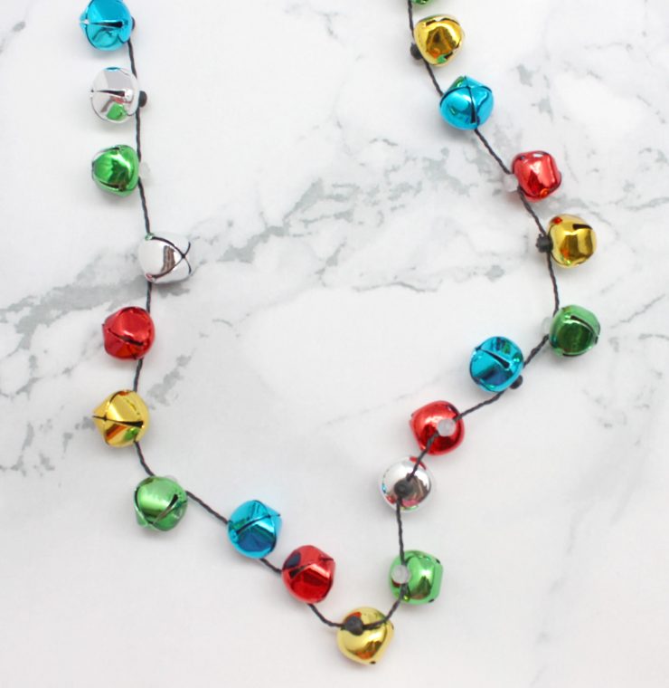 A photo of the Jingle Bell Light Up Necklace product