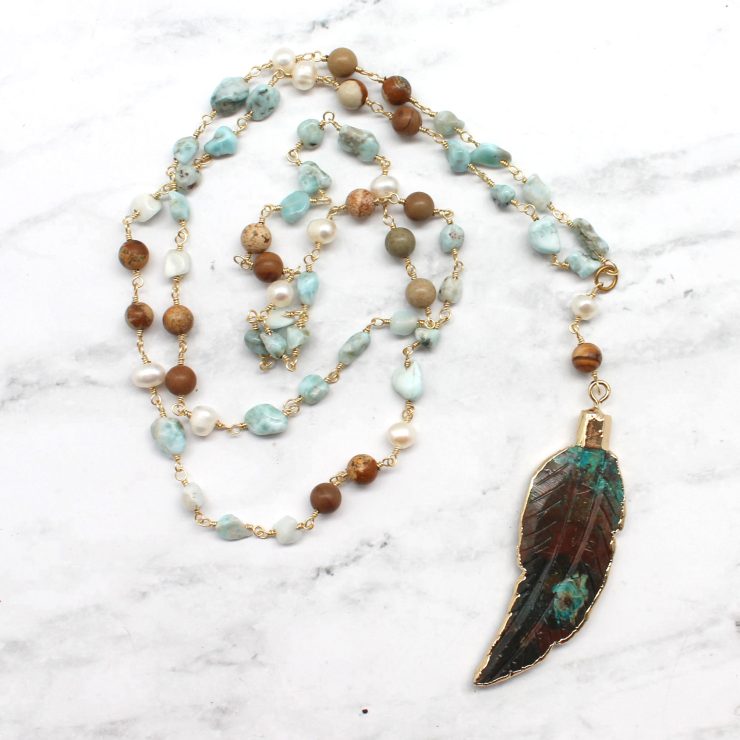 A photo of the Light As A Feather Necklace product