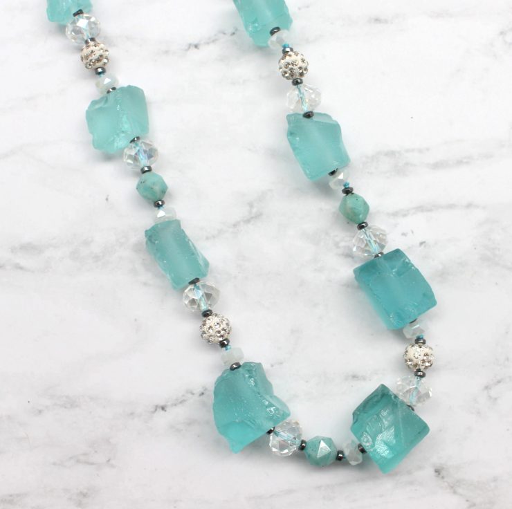A photo of the Never Blue Necklace product