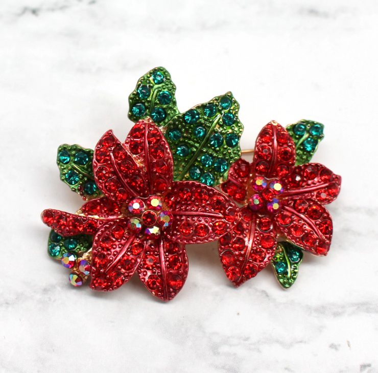 A photo of the Pretty Poinsettia Pin product