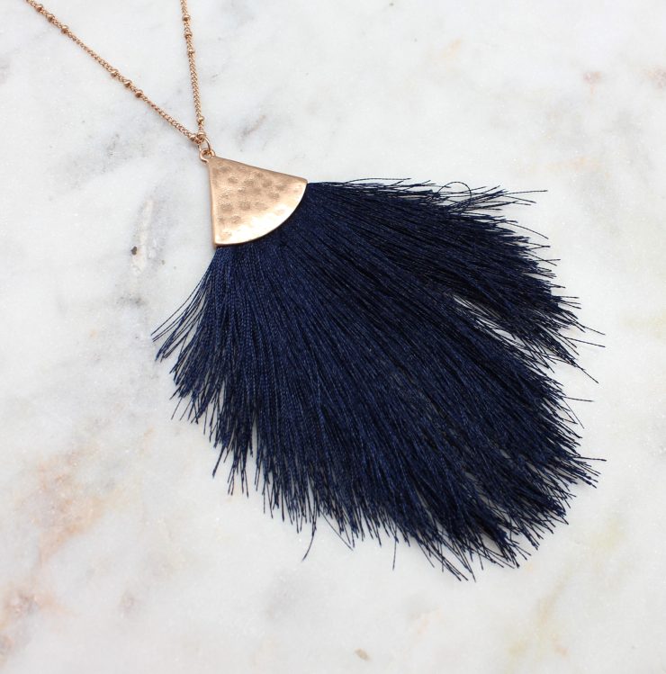 A photo of the Tassel Me Necklace product