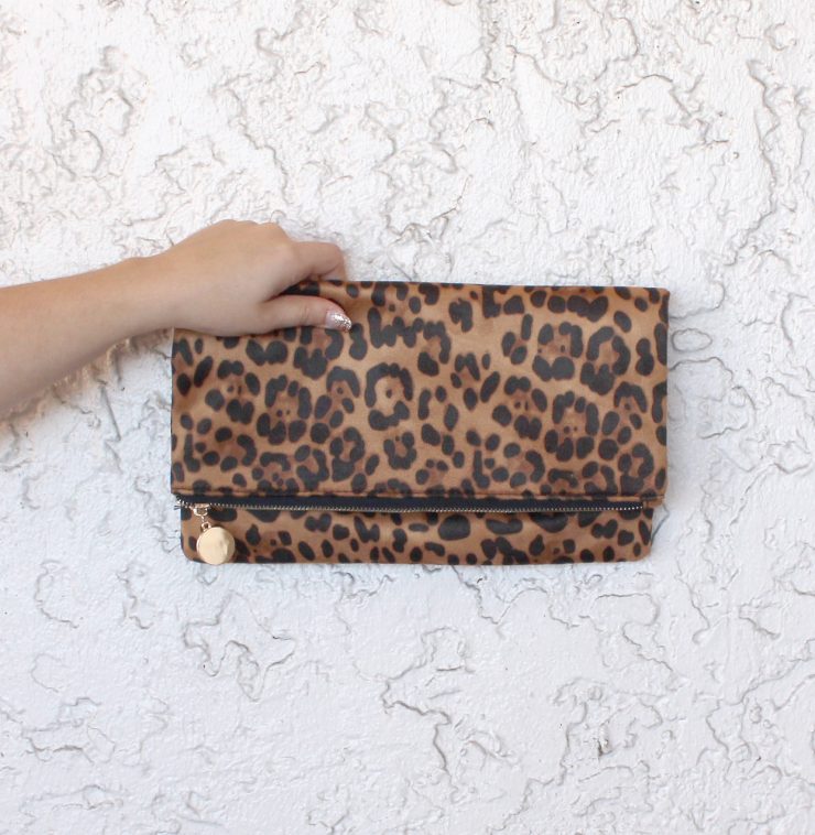 A photo of the That's Wild Cross Body Clutch product