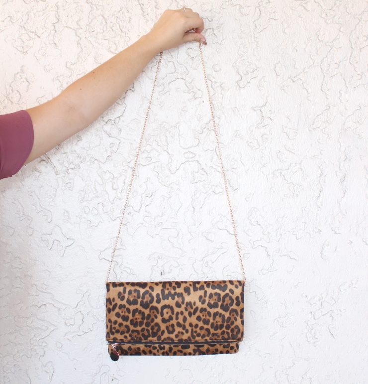 A photo of the That's Wild Cross Body Clutch product