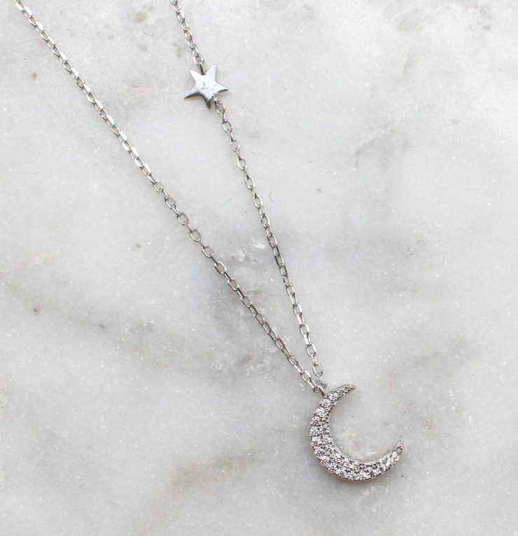 A photo of the Over The Moon Necklace product