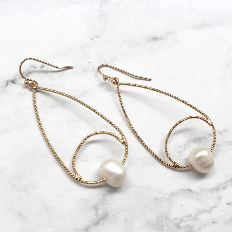 A photo of the Pearly Earrings product