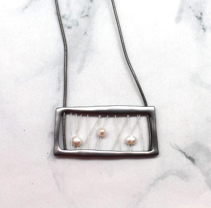 A photo of the Square Pearl Necklace product