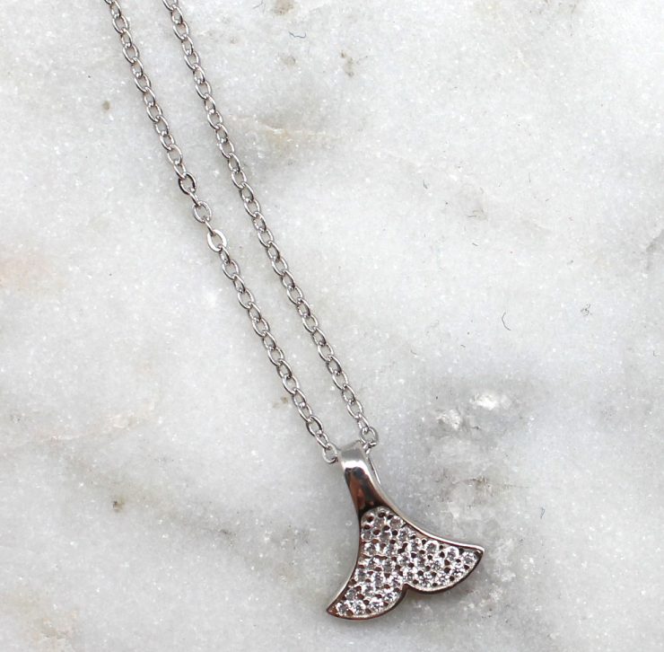 A photo of the Whale Tail Necklace product