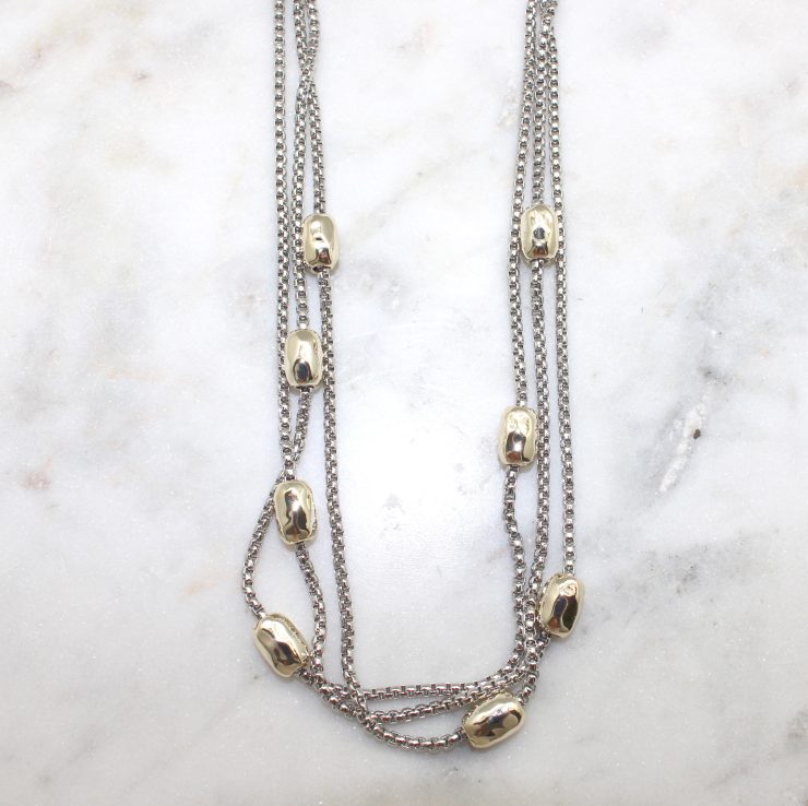 A photo of the Gold Bead Magnetic Necklace product