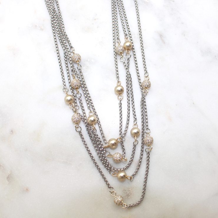 A photo of the Gold Beaded Layer Necklace product