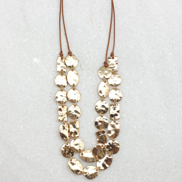 A photo of the Gold Pieces Necklace product