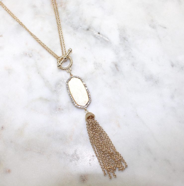 A photo of the Gold Tassel Necklace product