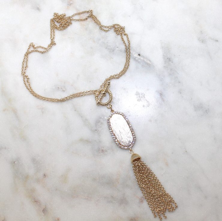 A photo of the Gold Tassel Necklace product