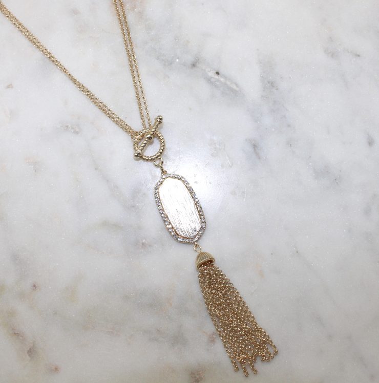 A photo of the Gold Tassel Necklace product