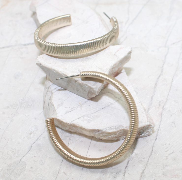 A photo of the Gold Textured Hoops product