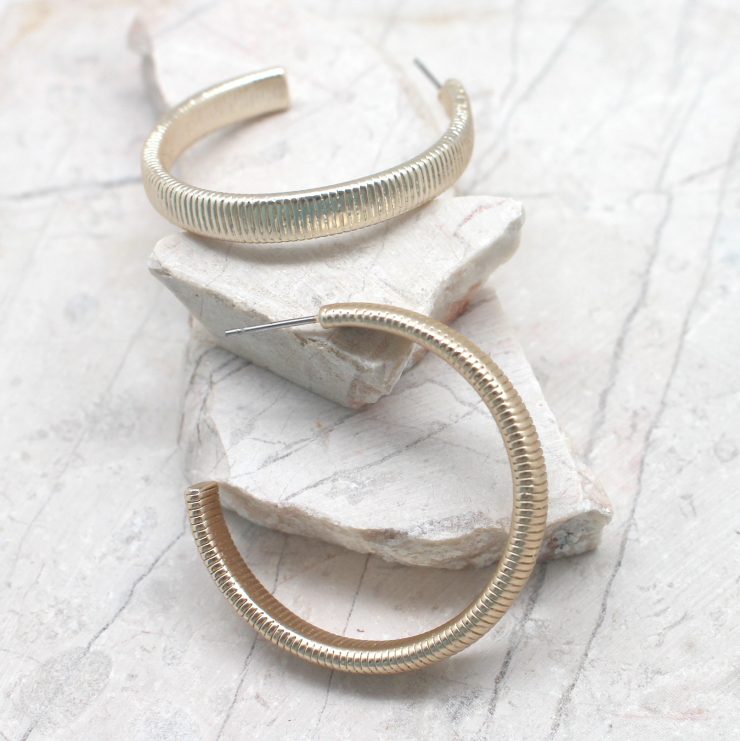 A photo of the Gold Textured Hoops product