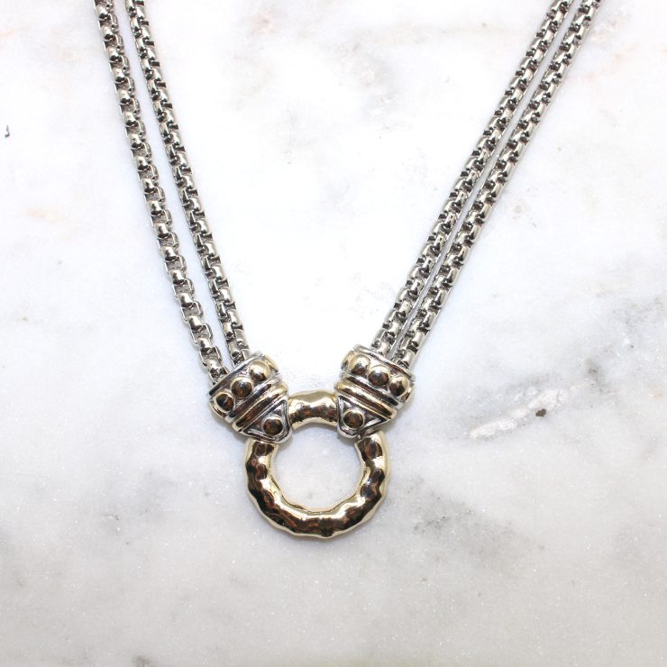 A photo of the Hammered Circle Necklace product