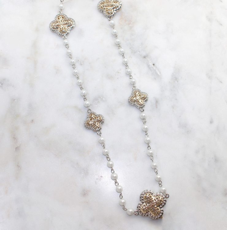 A photo of the Long Clover Pearl Necklace product