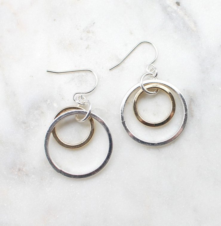 A photo of the Loopy Links Earrings product
