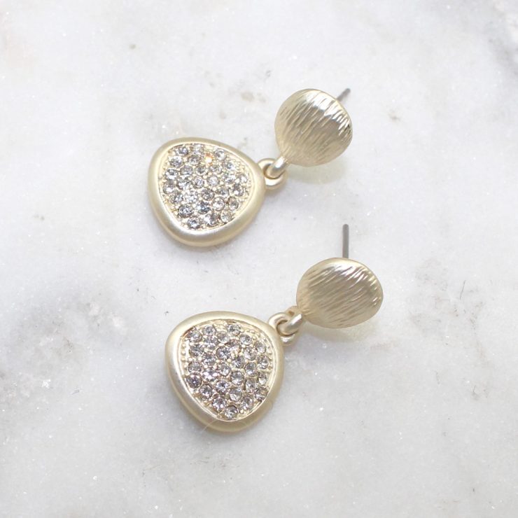 A photo of the Matte Gold Pebbles Earrings product