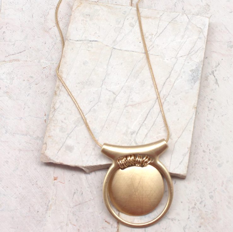 A photo of the Medallion Necklace product