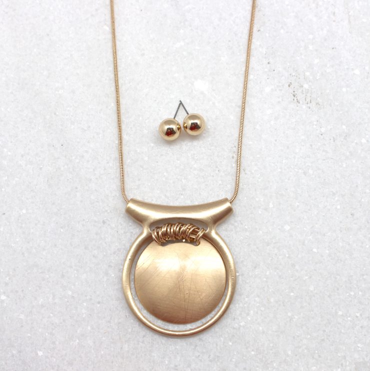 A photo of the Medallion Necklace product