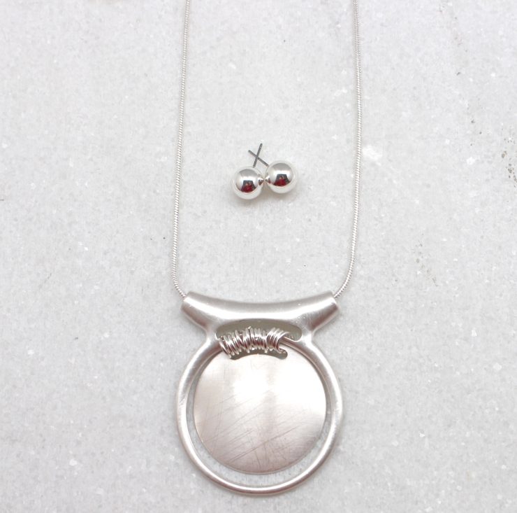 A photo of the Medallion Necklace product