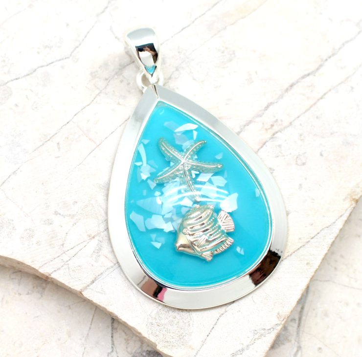 A photo of the Ocean Orb Pendant product
