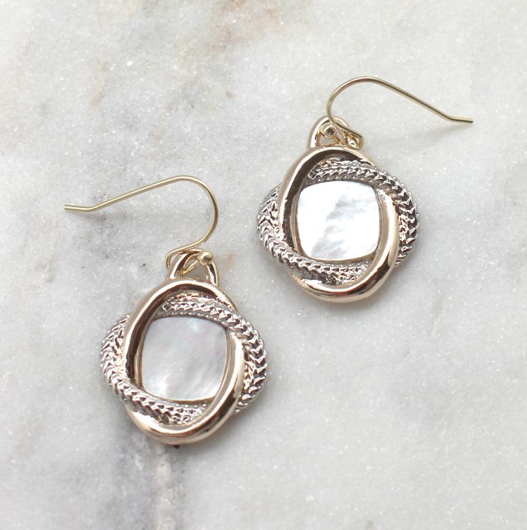 A photo of the Pearly Dangle Earrings product