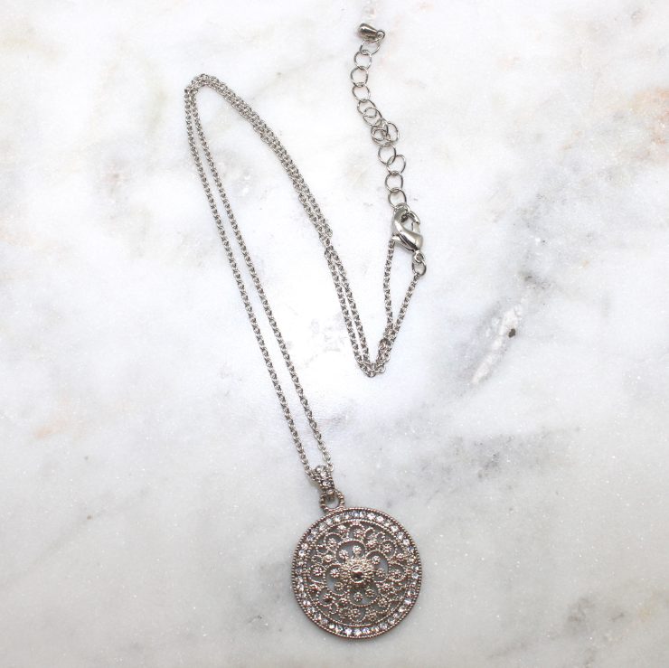 A photo of the Sun Dial Necklace product