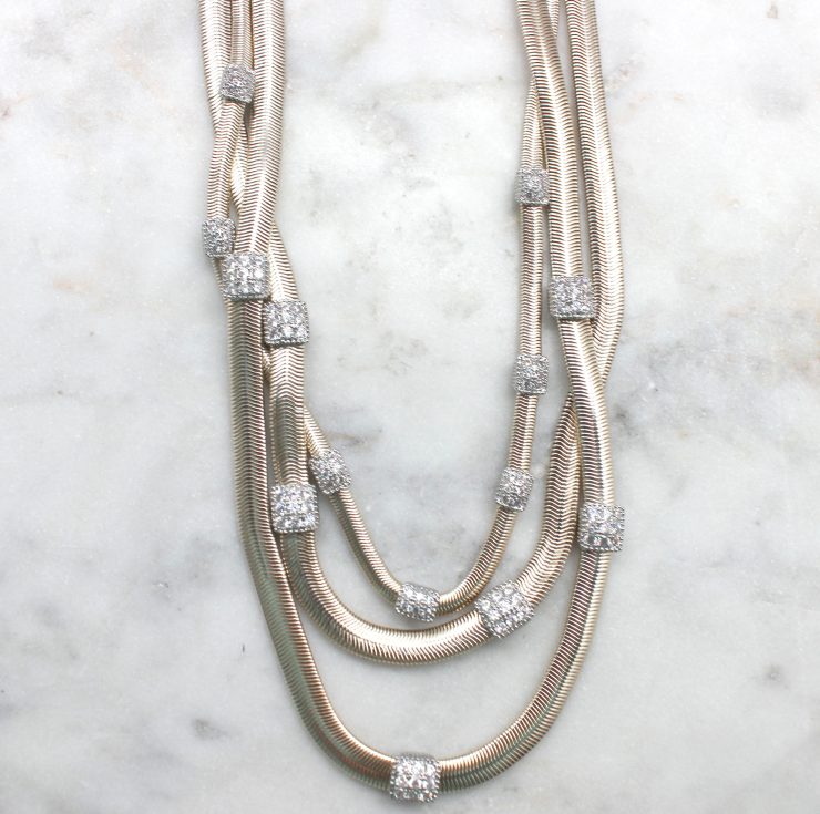 A photo of the Twisted Layers Magnetic Necklace product
