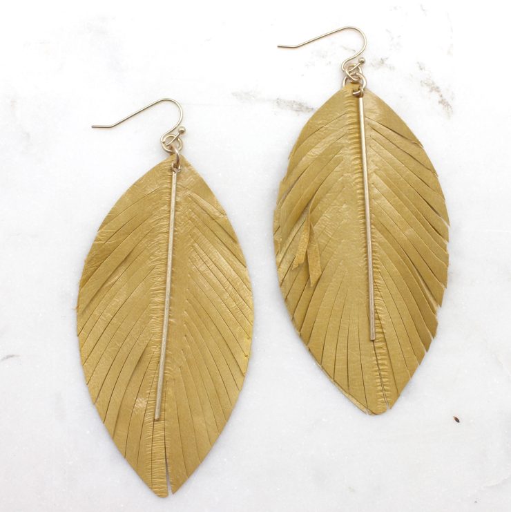 A photo of the Free Spirit Feather Earrings product