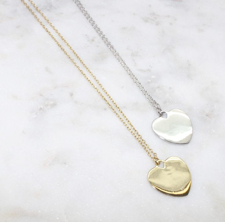 A photo of the Heart Strings Necklace product