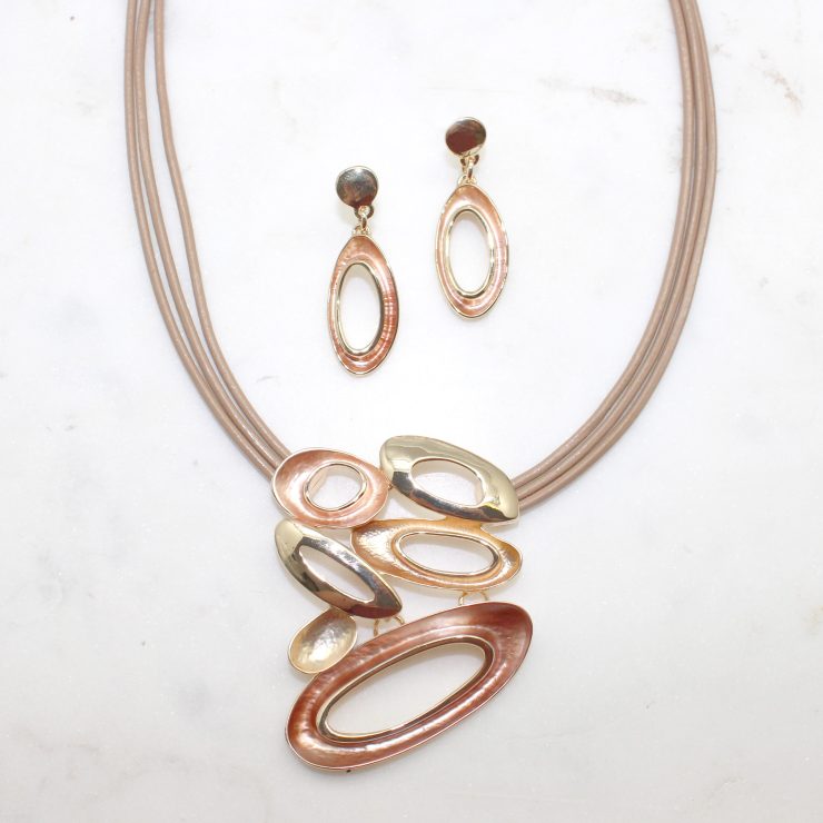 A photo of the Layered Loops Necklace product