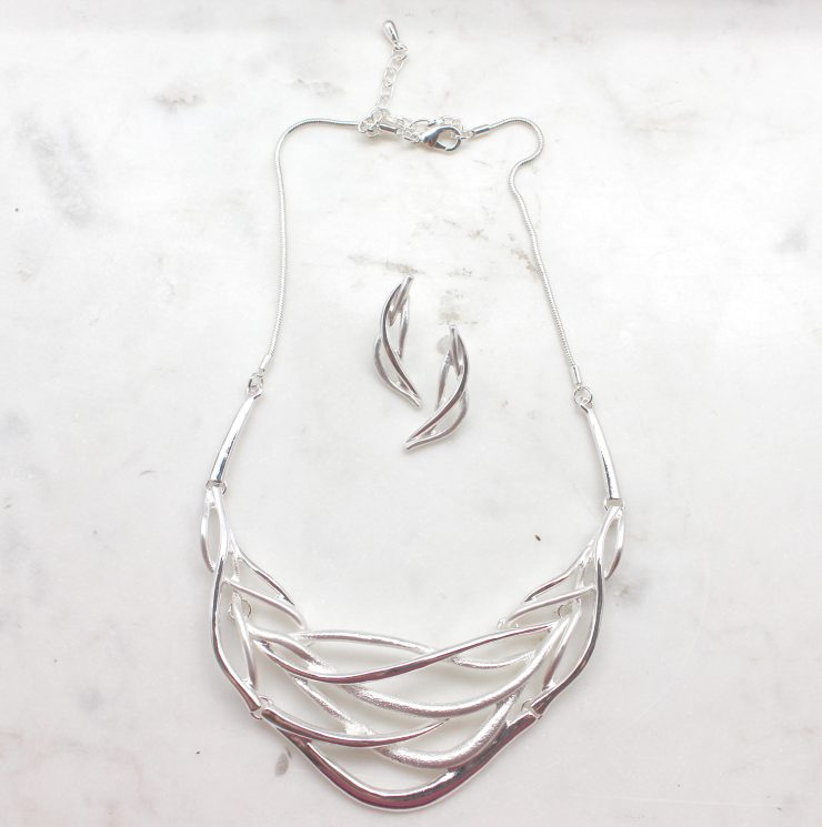 A photo of the Tangled Web Necklace product